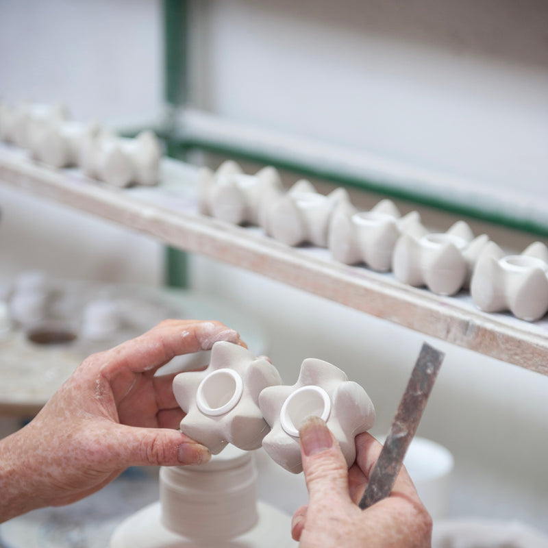 Handmade candle holders. Julia is checking every single item. Before glaze. Buy the beautiful candle holders online at JAHOKO.COM